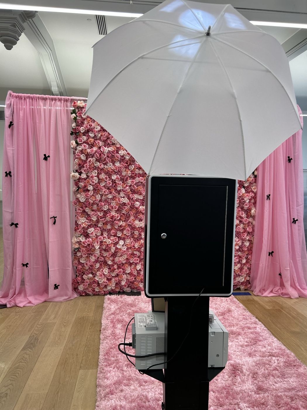 Pink and white floral wall photobooth backdrop setup