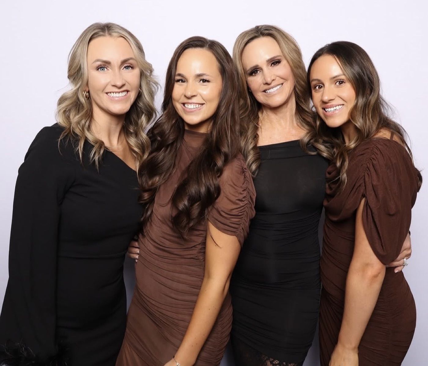Group of women posing together for a photobooth portrait