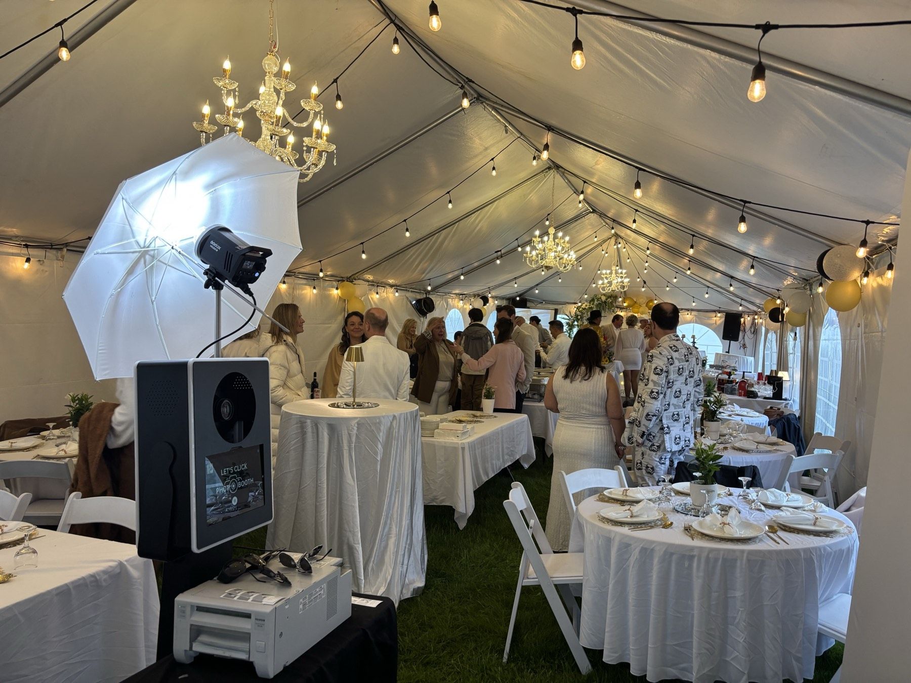 LetsClick Photobooth setup inside a tented outdoor wedding reception